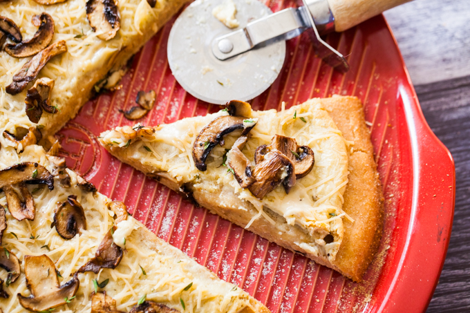 The ULTIMATE Vegan Wild Mushroom Garlic White Pizza | Seared garlic mushrooms and fresh thyme over a creamy garlic base | Cheezy, savory, and SO delicious | The perfect dinner party recipe