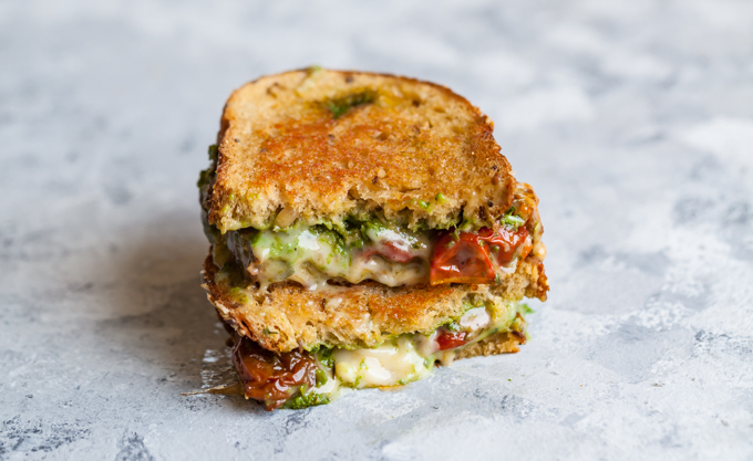 Make gourmet sandwiches for dinner in less than 10 minutes with this mega-easy Vegan Pesto Grilled Cheese - Kid-friendly, fast plant-based lunch or dinner recipe.